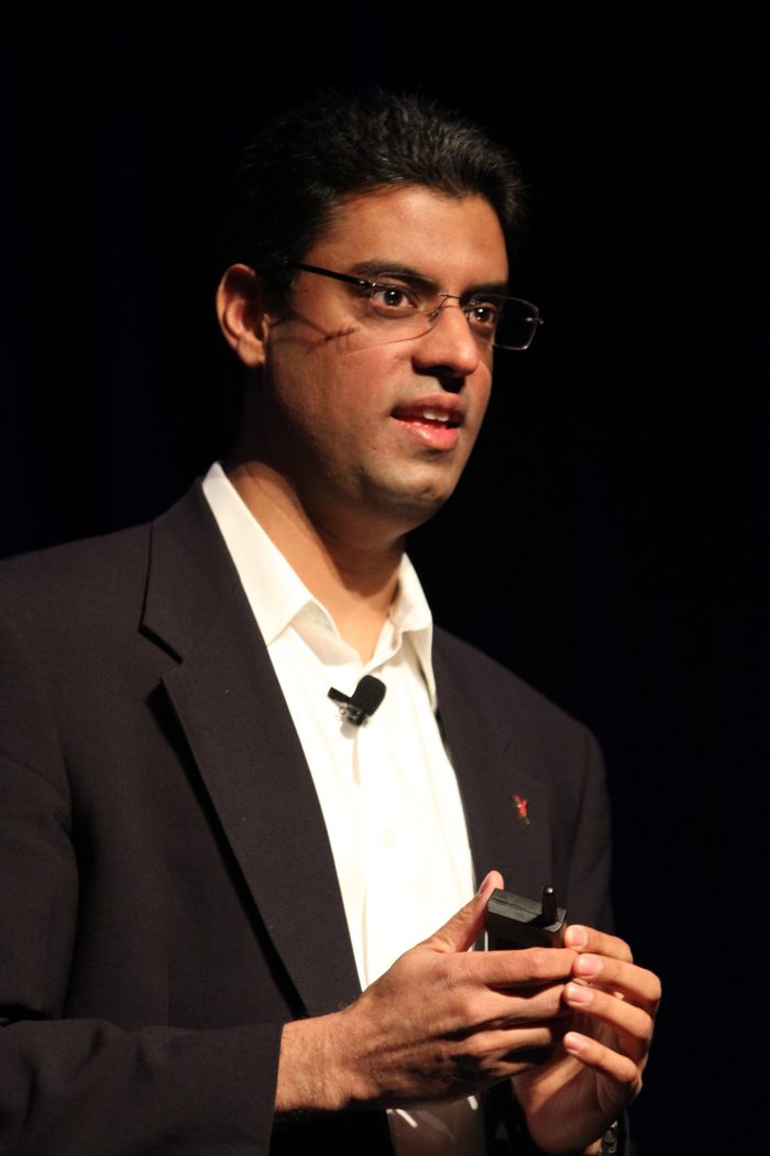 Ajay Chandramouly, Founder and CISO of SecuredAI, speaking at a conference, close up